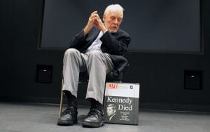 Stolley on stage with a LIFE magazine cover on display.
