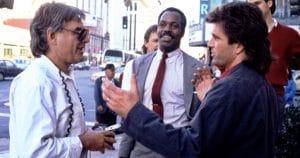 Donner, Danny Glover, and Mel Gibson on the street